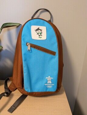2010 Vancouver Winter Olympics Miga Brown and Blue Mini Backpack. 8” x 13” x 4”